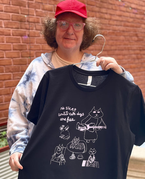 Susan Zelin “No Sleep Til” T-Shirt – Community Access Art Collective